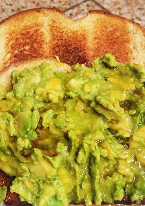 A picture of "Brioched style" toasted bread with Avocado & maple syrup.