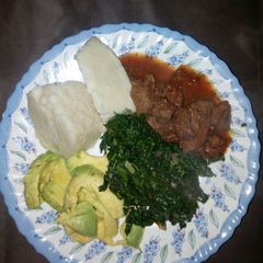 Ugali with wet fry beef n mixed greens/guacamole A picture of Ugali with wet fry beef n mixed greens/guacamole.