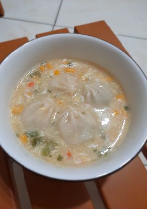 A picture of Scallop and Pickled Mustard Green Soup Dumplings.