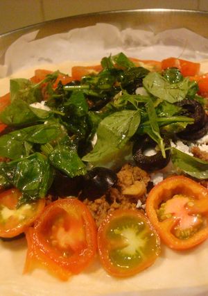 A picture of Beef Mince Galette topped with tomatoes, basil, spinach and feta.