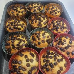 A picture of Orange Cup Cakes 🍊 with chocolate chip.