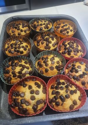 A picture of Orange Cup Cakes 🍊 with chocolate chip.