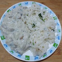 A picture of Mushroom Stroganoff with hurb rice.