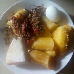 Boiled plantain,boiled yam,boiled egg and sauce A picture of Boiled plantain,boiled yam,boiled egg and sauce.