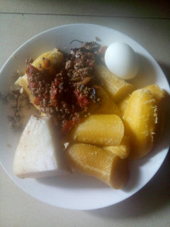 A picture of Boiled plantain,boiled yam,boiled egg and sauce.