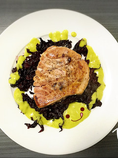 A picture of Tuna Medallion in Hibiscus Sauce with Guacamole.