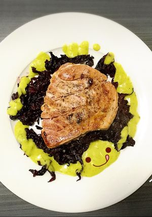 A picture of Tuna Medallion in Hibiscus Sauce with Guacamole.