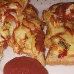 A picture of My loaded cheese & salsa pizza toast.