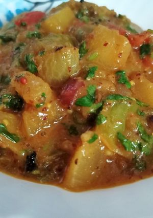 A picture of Radish potato brinjal curry in mustard paste.