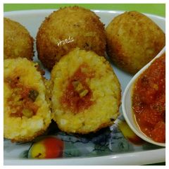 Fried Sambhar Rice Balls with stuffed Concasse Sauce A picture of Fried Sambhar Rice Balls with stuffed Concasse Sauce.
