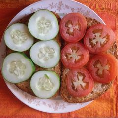 A picture of Cucumber, Tomato sandwich.