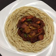 A picture of Spagetti and sauce.