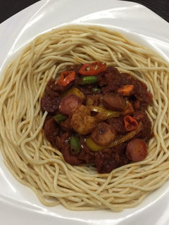 A picture of Spagetti and sauce.