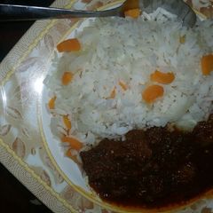 A picture of White rice with cabbage,carrot &stew.