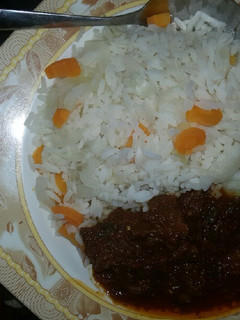 A picture of White rice with cabbage,carrot &stew.