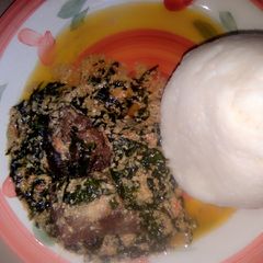 A picture of Tuwo Rice, ugu and egusi soup.
