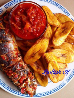 A picture of Fried plantain with grilled fish and sauce.
