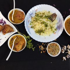 A picture of Burmese samosa curry with saffron rice.