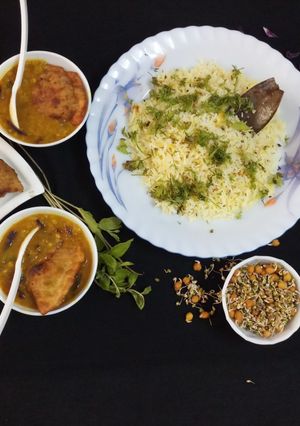A picture of Burmese samosa curry with saffron rice.