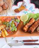 Rolled pork chops filled with "cheesy surprise" avocado salad a fried potato chips