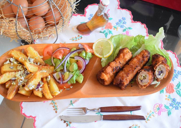 Rolled pork chops filled with "cheesy surprise" avocado salad a fried potato chips Rolled pork chops filled with "cheesy surprise" avocado salad a fried potato chips