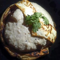 A picture of Sufiyana paneer(on the bed of lachcha parantha).