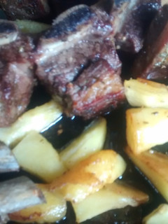 Una foto de Asado al horno con papas