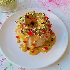 A picture of Thandai Bundt cake with Kesar thandai Rabdi frosting.