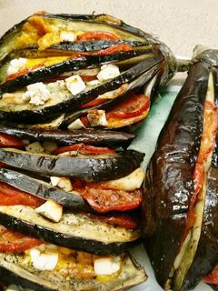 Una foto de Berenjenas tres quesos al horno