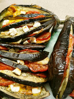 Una foto de Berenjenas tres quesos al horno