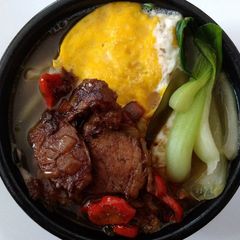 A picture of Brown rice pasta cooked in pork bone broth.