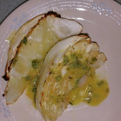 A picture of Roasted Cabbage with Chive-Mustard Vinaigrette.