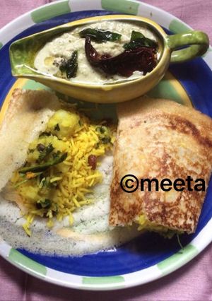 A picture of Andhra style MasalaDosa with Lemon rice.