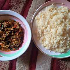 White couscous with egg sauce A picture of White couscous with egg sauce.