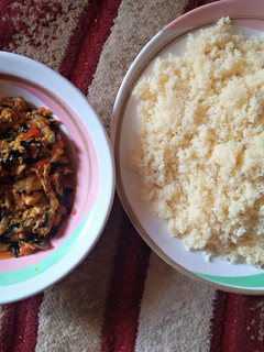 A picture of White couscous with egg sauce.