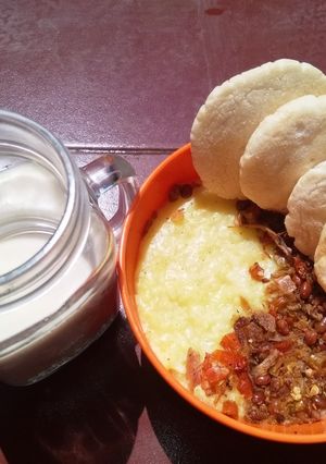 Foto resep BuKu TOBaTe😅 (Bubur Kunyit Topping Oseng Bawang Putih Teri dll)