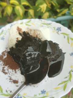 A picture of Hot Fudge Cake with Ice Cream.
