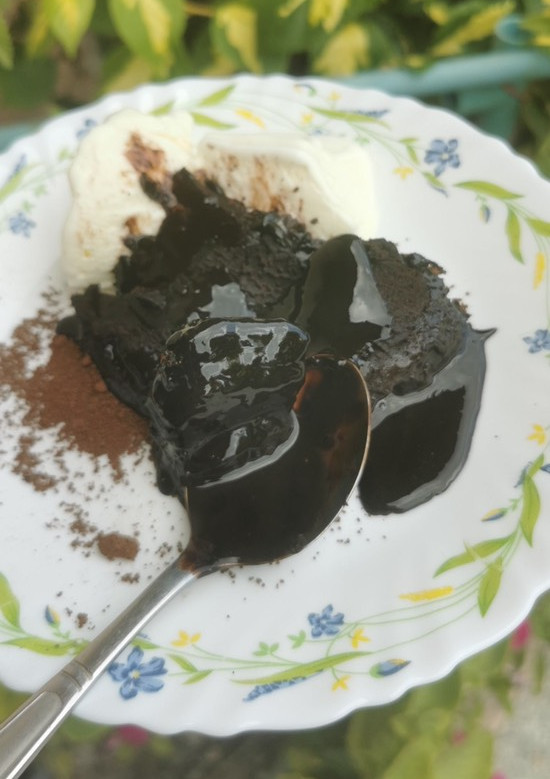 A picture of Hot Fudge Cake with Ice Cream.