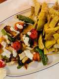 Spiedini di pesce con carciofi trifolati