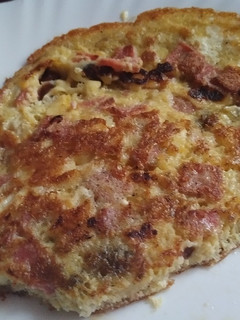 A picture of Fried Eggs with brawn & cheese.