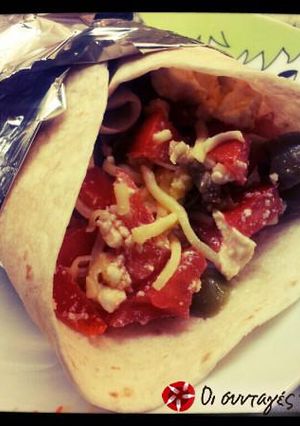 A picture of Burritos with omelette the greek way.