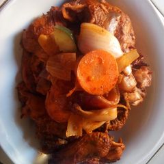 A picture of Barked chicken with vegetable.