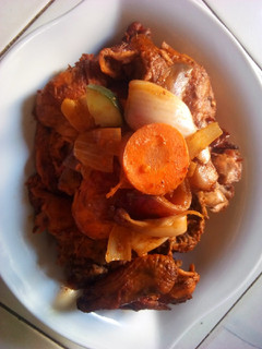 A picture of Barked chicken with vegetable.