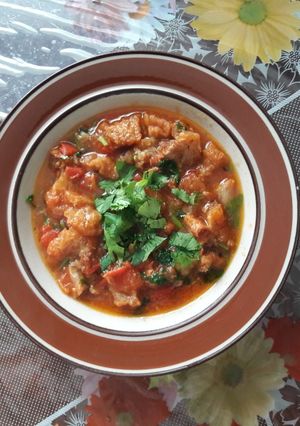 Una foto de Chicharrón entomatado