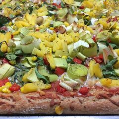 A picture of Pizza with Pineapple and Spinach.