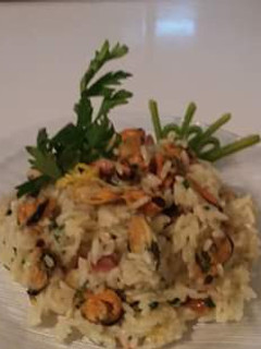 Una foto de Arroz con mejillones