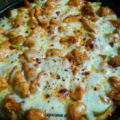 Chicken Tikka pizza on stove 😋 #ramadankitayari A picture of Chicken Tikka pizza on stove 😋 #ramadankitayari.