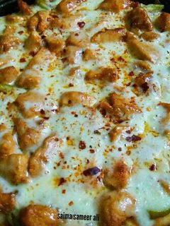 A picture of Chicken Tikka pizza on stove 😋 #ramadankitayari.