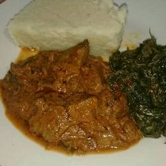Ugali beef stew and managu A picture of Ugali beef stew and managu.