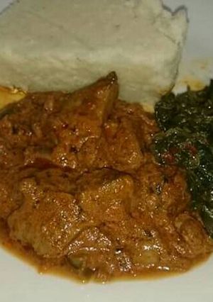 A picture of Ugali beef stew and managu.